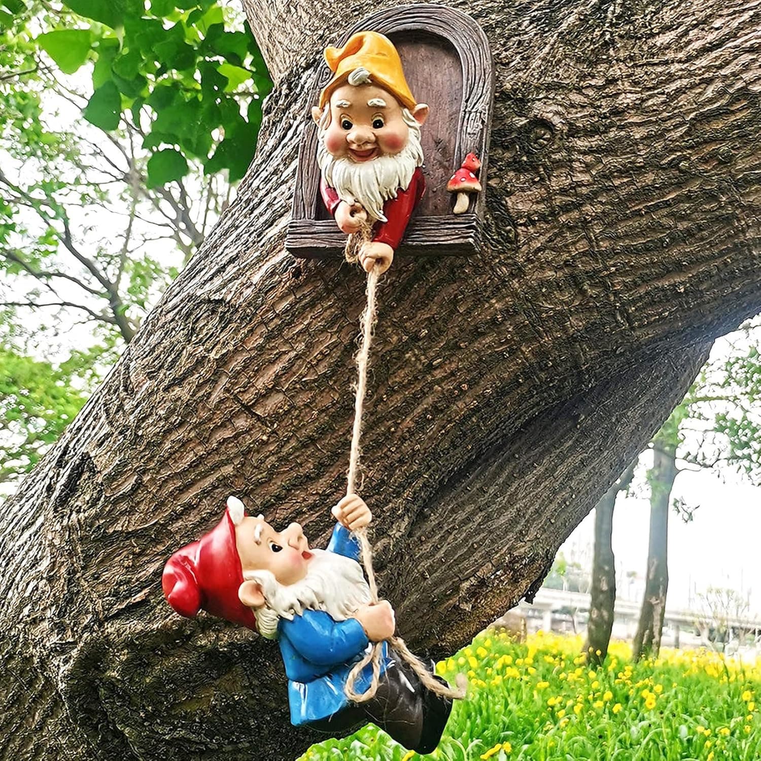 Garden sculpture, outdoor, little elf climbing a tree, three gnomes, artwork.